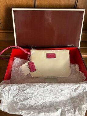 COACH Ivory Wristlet with Pink Trim and Strap